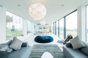 Living area with bean bag and sliding doors in beach home of soho house architect alex michaelis in cornwall available to rent with Beachspoke