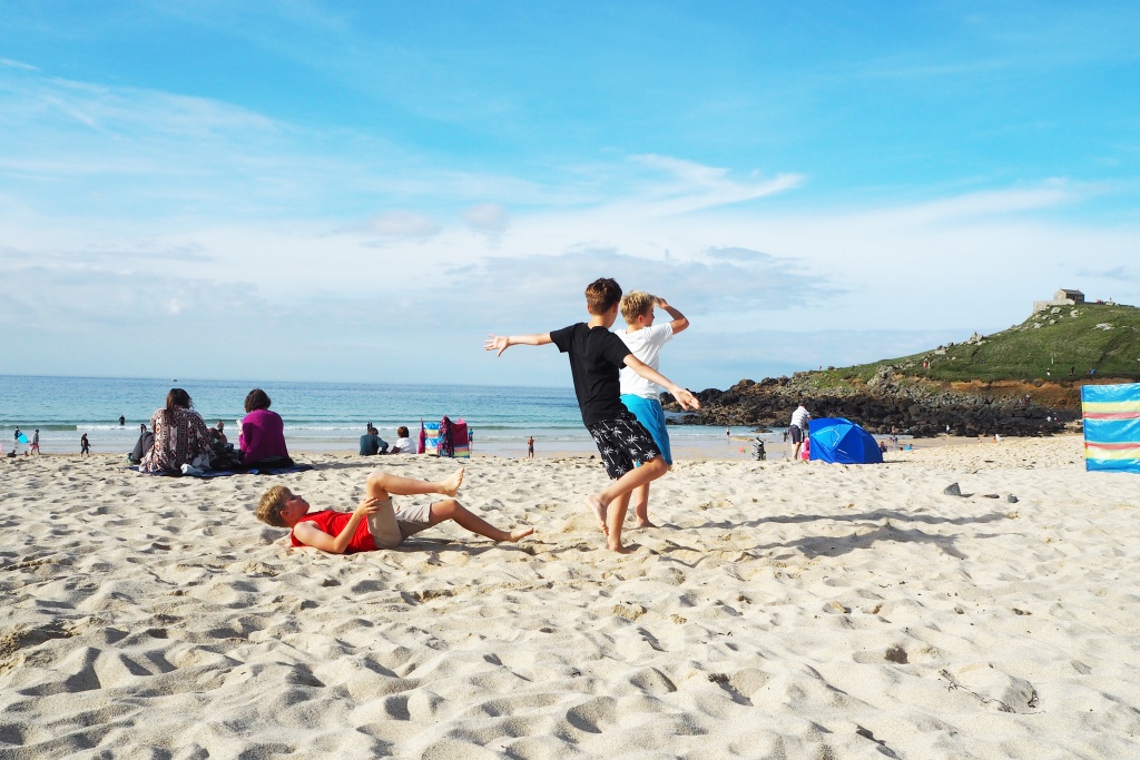 Football and frolics on Porthmeor Beach via the secret tunnel at the back of Beachspoke's Coxswain's Cottage in St Ives Cornwall